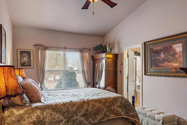 bedroom with a ceiling fan and lofted ceiling