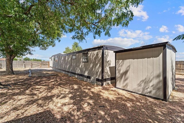 view of property exterior with fence