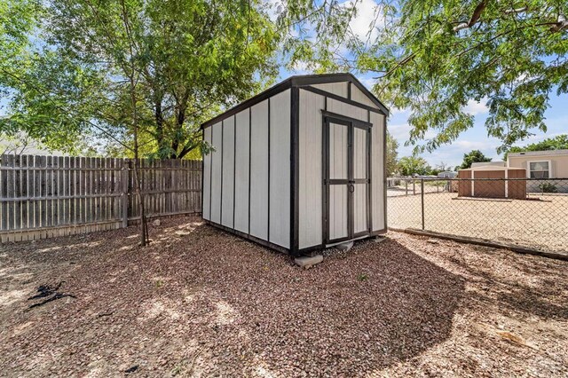 view of shed with a fenced backyard