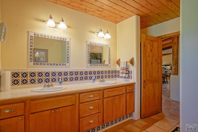 full bathroom featuring double vanity, tile patterned flooring, a sink, and wood ceiling