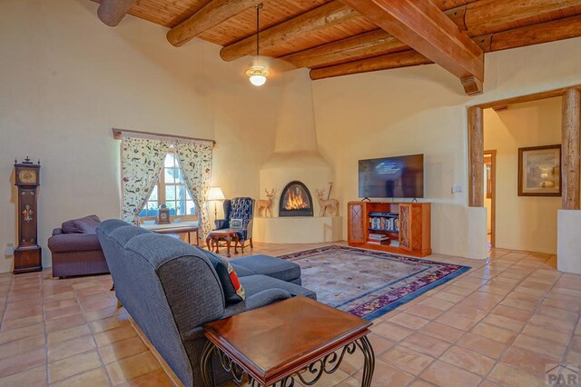 tiled living room with a towering ceiling, a large fireplace, wood ceiling, and beam ceiling