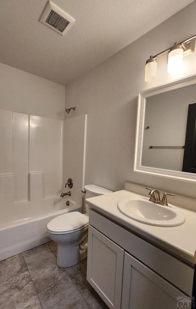 full bath with toilet, vanity, visible vents, and shower / bathing tub combination