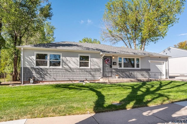 1121 Alexander Cir, Pueblo, CO 81001 - ranch-style house featuring a garage and a front yard