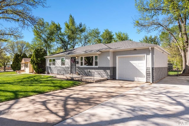 1121 Alexander Cir, Pueblo, CO 81001 - ranch-style house with a garage, driveway, a front yard, stucco siding, and a shingled roof