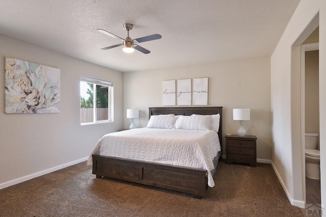 bedroom with ceiling fan, baseboards, dark colored carpet, and a textured ceiling