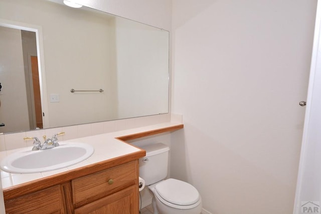 1135 Mount Estes Dr, Colorado Springs, CO 80921 - half bathroom with vanity and toilet