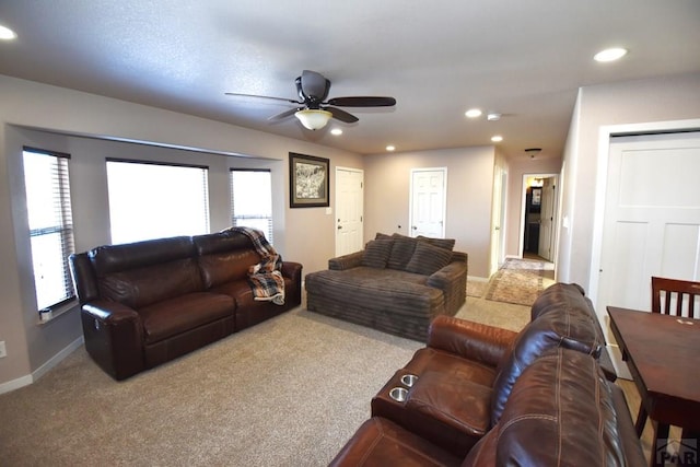 carpeted living room with baseboards, a ceiling fan, and recessed lighting