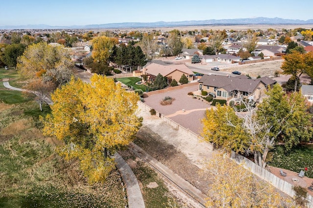 drone / aerial view with a residential view and a mountain view