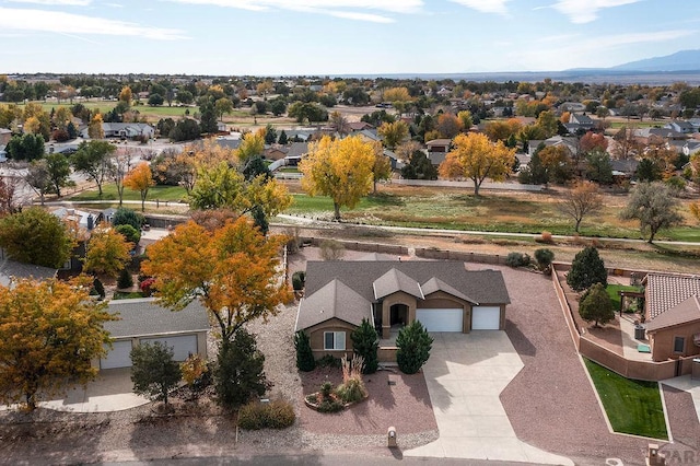 birds eye view of property with a mountain view and a residential view