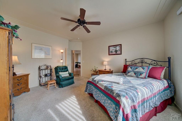 carpeted bedroom with ceiling fan and crown molding