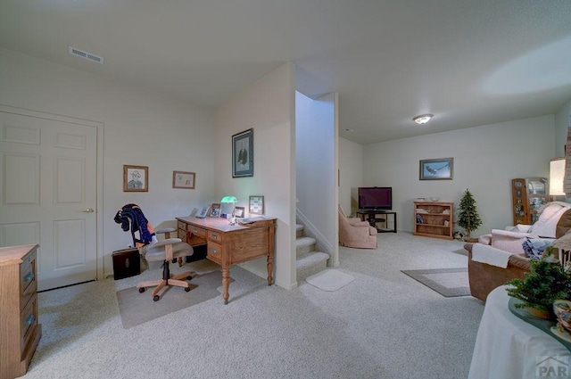 office space with light carpet and visible vents