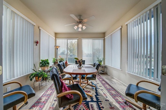 sunroom with a ceiling fan