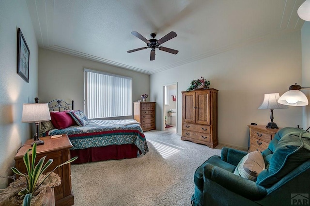 bedroom with light carpet, ceiling fan, ensuite bath, and crown molding