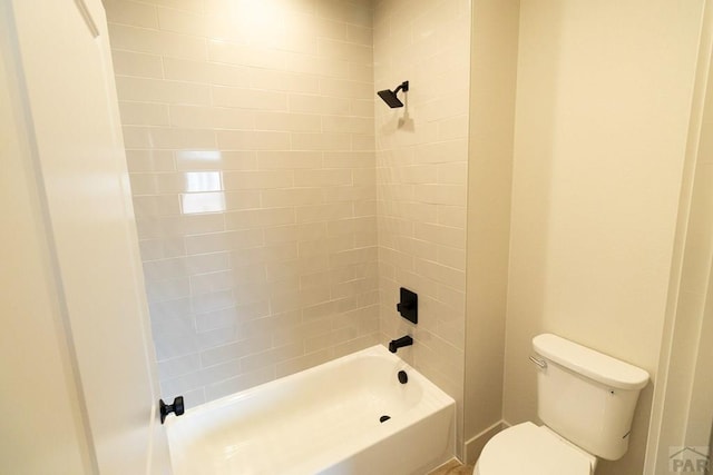 bathroom featuring  shower combination and toilet