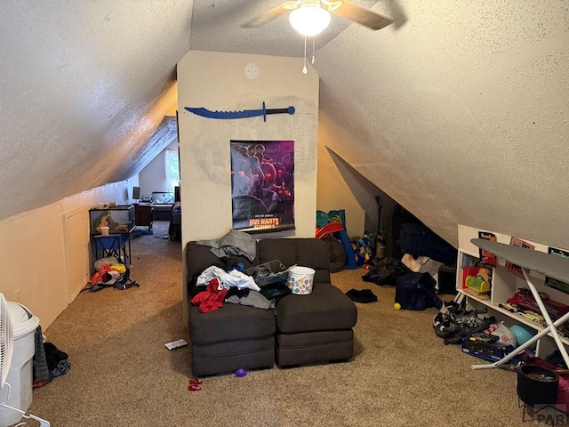 additional living space with a textured ceiling, vaulted ceiling, a ceiling fan, and carpet floors
