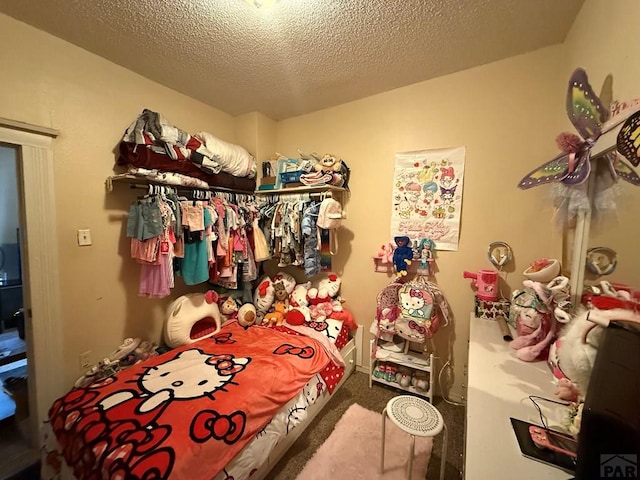 carpeted bedroom featuring a textured ceiling