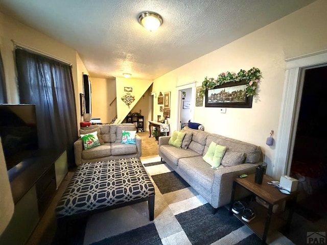 living area with a textured ceiling
