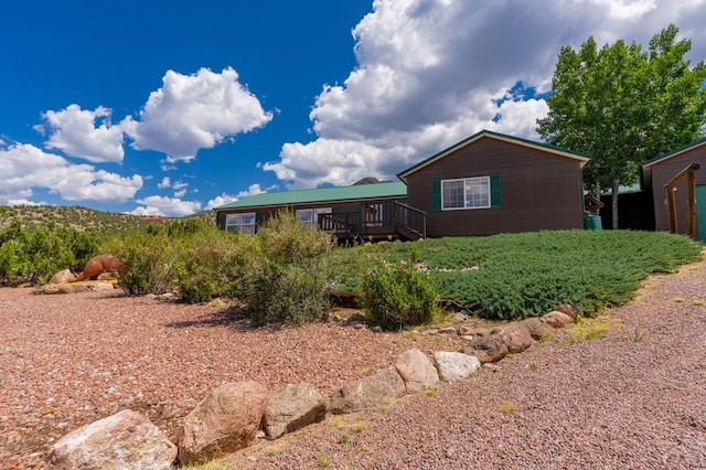 rear view of property with a deck