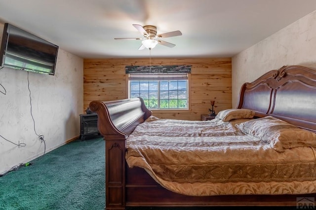 bedroom featuring carpet floors, wood walls, and ceiling fan