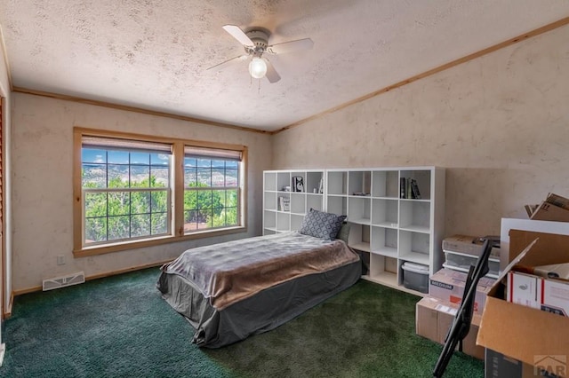 carpeted bedroom with lofted ceiling, visible vents, a ceiling fan, ornamental molding, and a textured ceiling