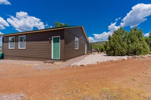 view of side of property featuring driveway