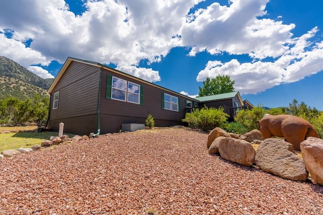 view of home's exterior featuring a mountain view