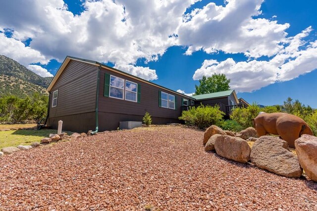 view of home's exterior featuring a mountain view