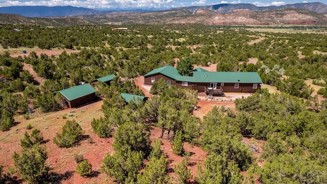 bird's eye view featuring a mountain view and a view of trees