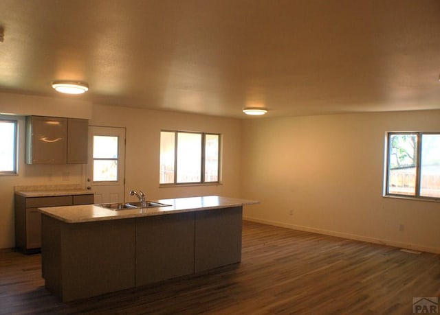33 Regency Blvd, Pueblo, CO 81005 - kitchen featuring dark wood finished floors, plenty of natural light, and light countertops