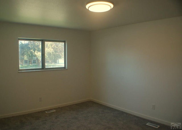 33 Regency Blvd, Pueblo, CO 81005 - empty room with baseboards and dark carpet