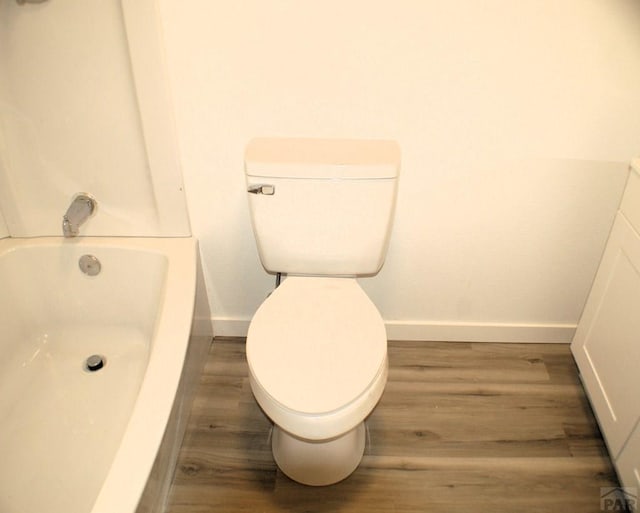 33 Regency Blvd, Pueblo, CO 81005 - bathroom with wood finished floors and a bathtub