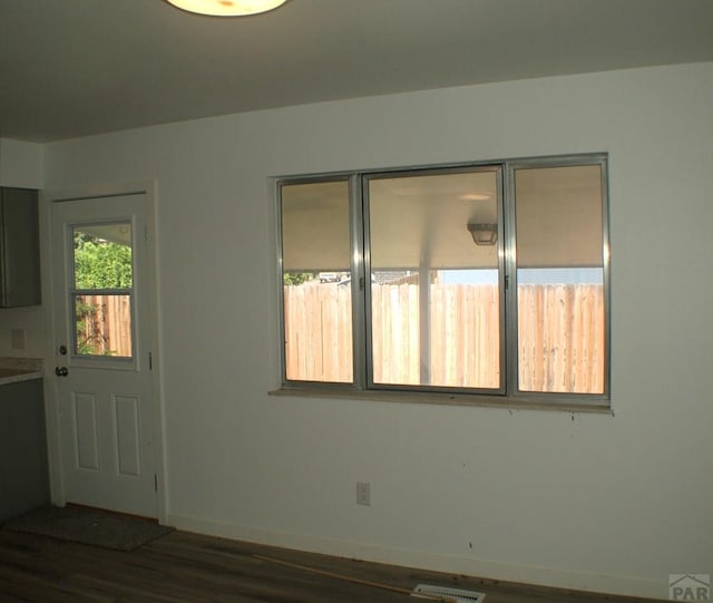 33 Regency Blvd, Pueblo, CO 81005 - unfurnished room featuring dark wood-style floors and baseboards