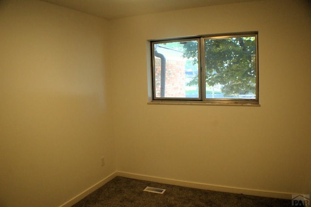 33 Regency Blvd, Pueblo, CO 81005 - spare room with baseboards and dark colored carpet