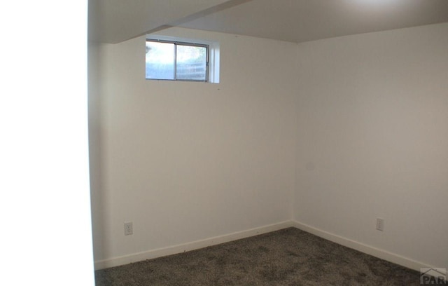 33 Regency Blvd, Pueblo, CO 81005 - below grade area featuring dark carpet and baseboards