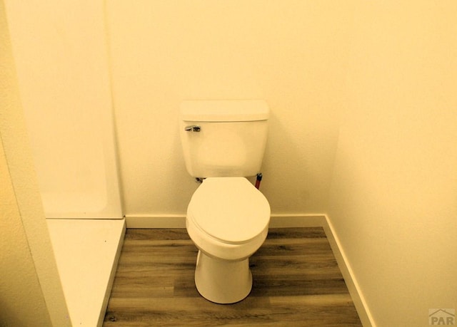 33 Regency Blvd, Pueblo, CO 81005 - bathroom with toilet and wood finished floors