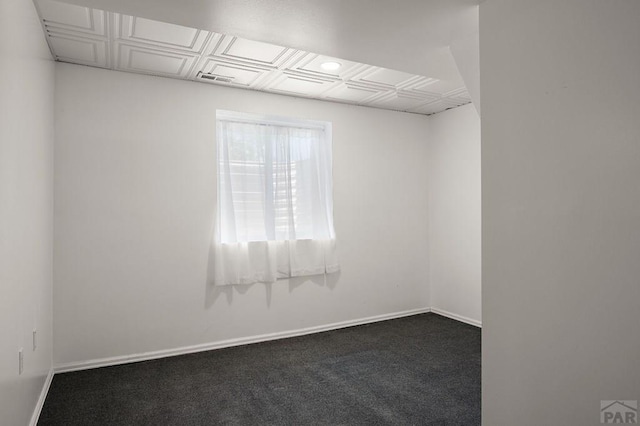 228 S Caddoa Dr, Pueblo West, CO 81007 - empty room with baseboards and carpet flooring