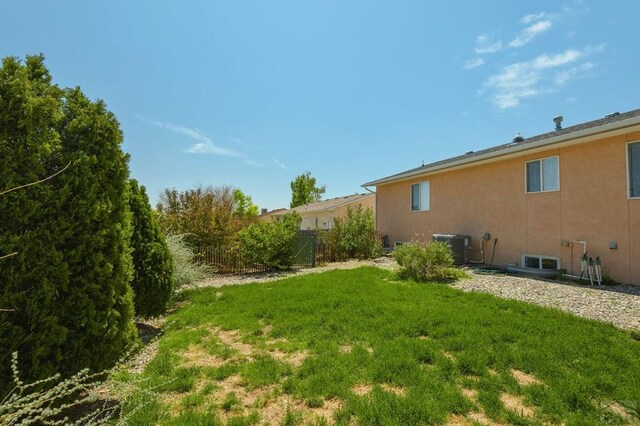 228 S Caddoa Dr, Pueblo West, CO 81007 - view of yard featuring central AC unit
