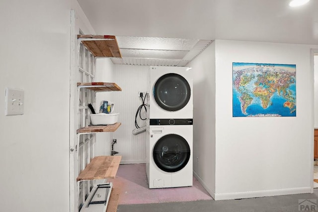 228 S Caddoa Dr, Pueblo West, CO 81007 - laundry area with stacked washing machine and dryer and baseboards