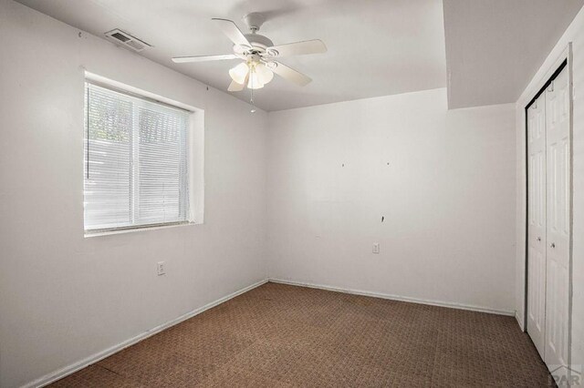 228 S Caddoa Dr, Pueblo West, CO 81007 - unfurnished bedroom with a closet, carpet floors, a ceiling fan, and baseboards