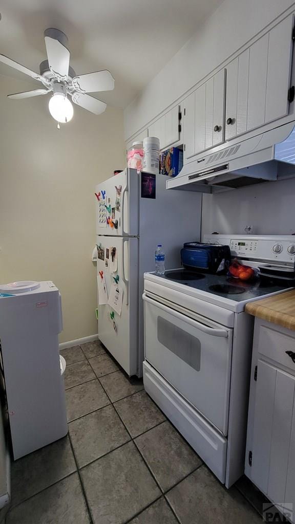 kitchen with white electric stove, white cabinets, a ceiling fan, under cabinet range hood, and light tile patterned flooring