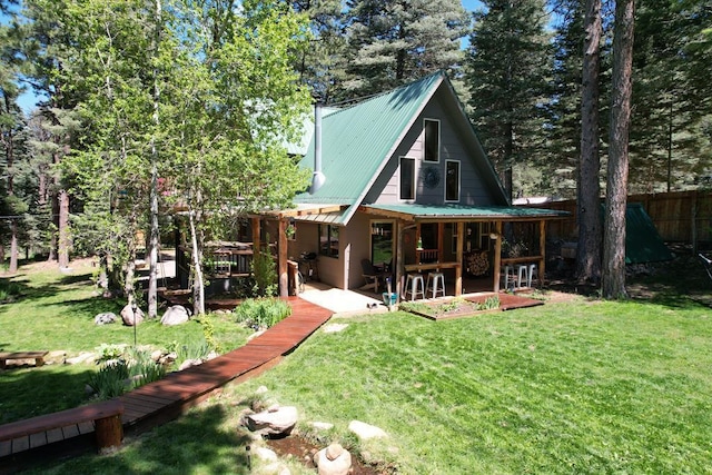 10421 Linger Longer Ln, Rye, CO 81069 - back of property with metal roof and a patio area
