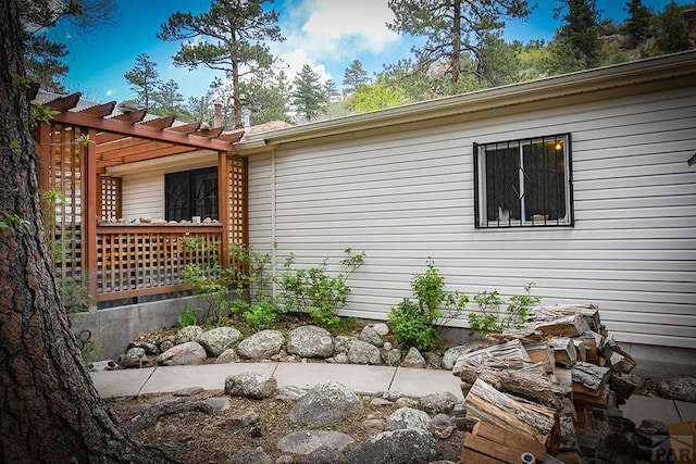 8946 Central Ave, Beulah, CO 81023 - view of side of home featuring a pergola