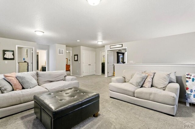6740 Spruce Hill Ct, Colorado Springs, CO 80923 - carpeted living room featuring baseboards