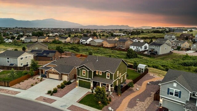 6740 Spruce Hill Ct, Colorado Springs, CO 80923 - aerial view at dusk of a residential view and a mountain view