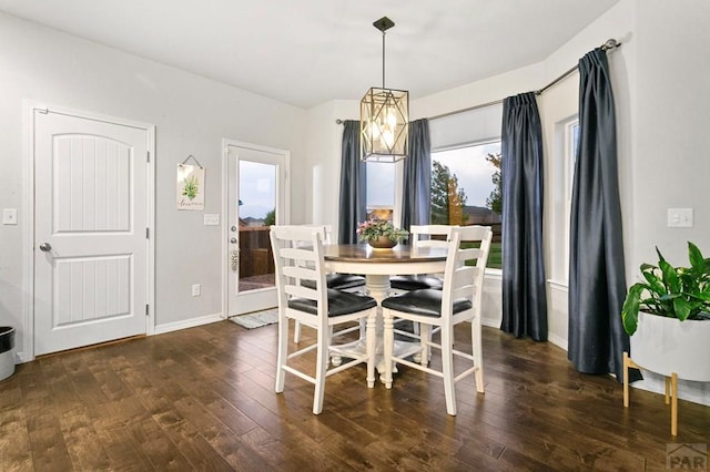 6740 Spruce Hill Ct, Colorado Springs, CO 80923 - dining space featuring dark wood-type flooring and baseboards