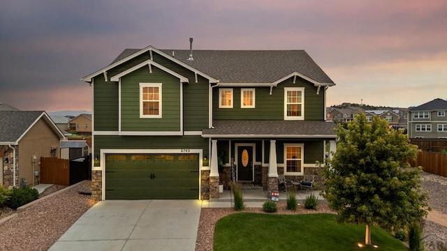 6740 Spruce Hill Ct, Colorado Springs, CO 80923 - craftsman house with a porch, concrete driveway, a shingled roof, and stone siding