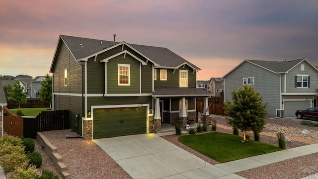 6740 Spruce Hill Ct, Colorado Springs, CO 80923 - craftsman inspired home featuring a porch, stone siding, driveway, and an attached garage