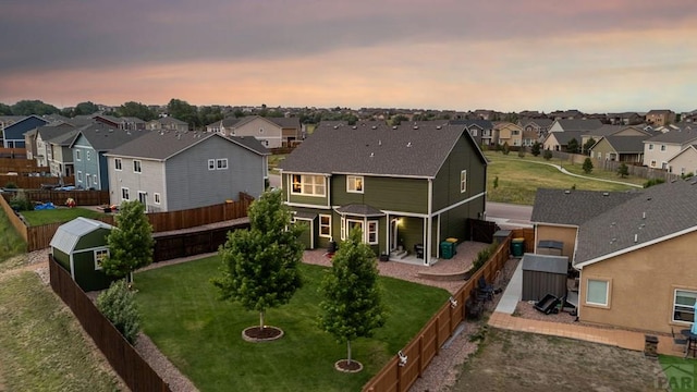 6740 Spruce Hill Ct, Colorado Springs, CO 80923 - rear view of property featuring a residential view, a fenced backyard, and a patio