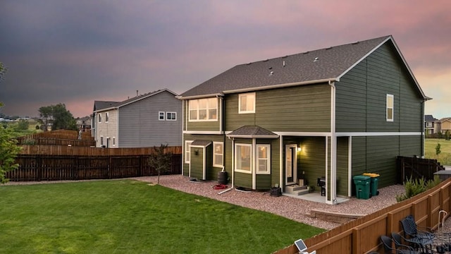 6740 Spruce Hill Ct, Colorado Springs, CO 80923 - back of property at dusk featuring a fenced backyard and a shingled roof