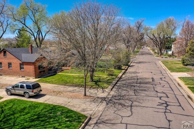 view of home's community with a lawn